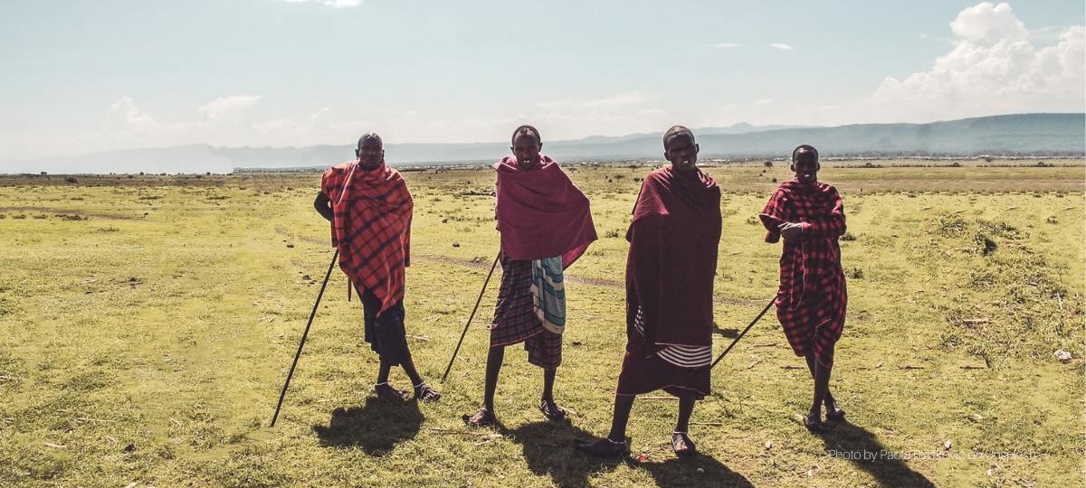 Four Masai men - Photo by Paola Blašković on Unsplash